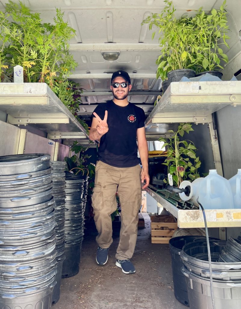 Juan volunteering for an edible garden installation in Miami